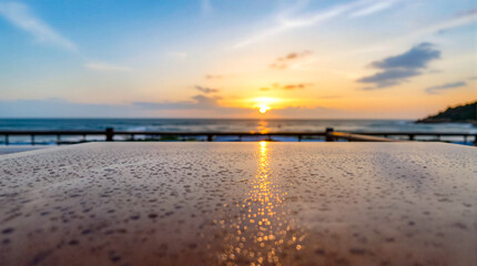 Sunset Reflection on Wet Table by the Ocean