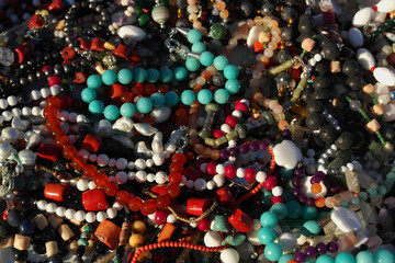 Background of various bracelets with multicolored stones