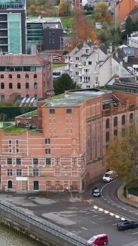 molens van temse historical building near river scheldt scene includes church surrounding village aerial drone shot belgium quay landmark residential area 