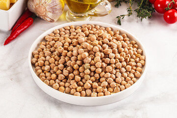 Dry chickpea seeds heap in the bowl