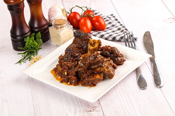 Prepared tasty beef ribs with sauce