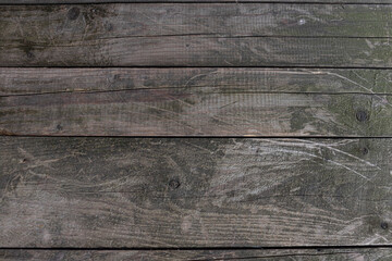 Obraz premium A horizontal wooden surface with distinct grain patterns and a natural rustic appearance.