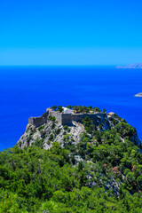 Monolithos Castle in paradise landscape scenery - travel destination on beautiful island Rhodes, Greece