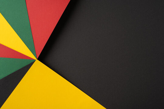 Creative abstract design showcasing colorful paper textures in red, yellow, green, and black hues