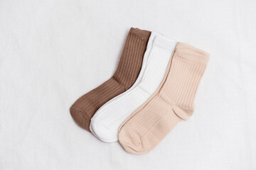  Ribbed Socks beautifully designed in various Earthy Tones on white background.