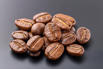 Fototapeta premium Rich, Dark Roasted Coffee Beans Exuding Aroma and Flavor on a Sleek Surface