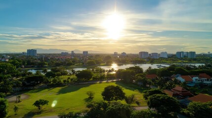 Stunning Aerial Sunset View of Cityscape Park Lake and Green Space