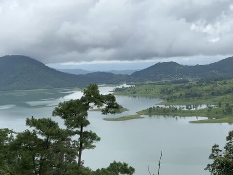 Umiam Lake and Scenic Surroundings in Meghalaya - Tranquil Landscapes with Lush Greenery, Forested Hills, and Cloudy Skies, Perfect for Nature Lovers and Photography Enthusiasts