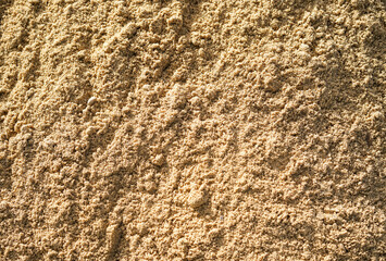 Empty rough brown sand surface for abstract background and texture. beautiful patterns, space for work, banner, seamless wallpaper close up.