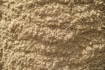 Empty rough brown sand surface for abstract background and texture. beautiful patterns, space for work, banner, seamless wallpaper close up.