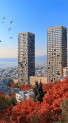 Obraz premium Stunning Autumn Cityscape Featuring Twin Skyscrapers with Vibrant Red Foliage and Bird Silhouette Under Clear Blue Sky in Urban Horizon Near Waterfront View