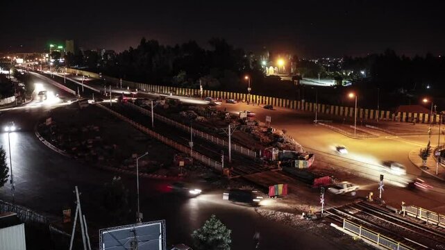 Timelapse of traffic moving through a roundabout in Addis Ababa, Ethiopia at night.