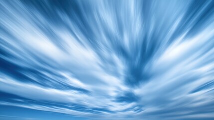 A dynamic sky with streaks of clouds in various shades of blue, creating a sense of motion.