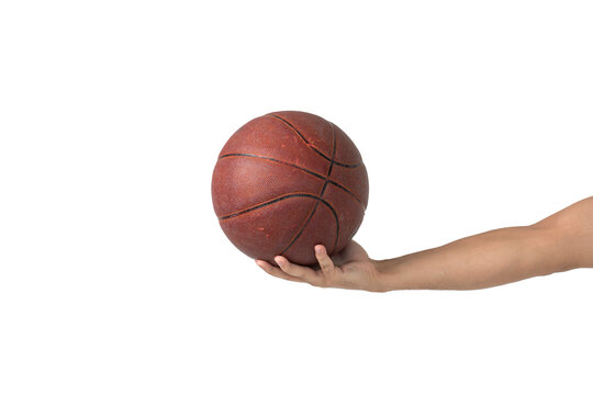 Hand holding basketball ball
