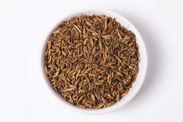 Caraway Seeds in a White Bowl: Aromatic and Flavorful Spice