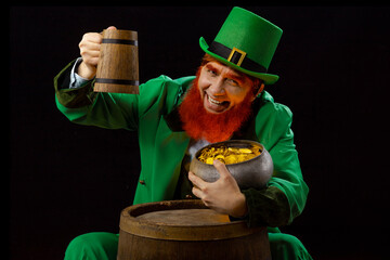 Leprechaun elf on St. Patrick's Day. Cheerful character Irish leprechaun for advertising with a red...