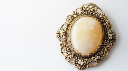 Naklejka premium Vintage Brooch with Oval Cream Stone and Intricate Metal Frame