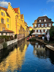 Fototapeta premium Colmar, France - Sunset golden hour view of the Petit Venice canal waterway at Christmas time