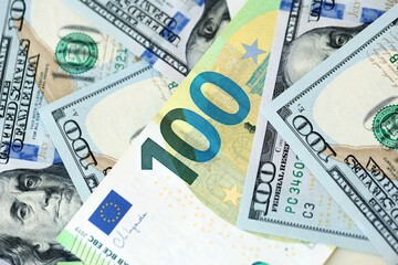 Big pile of Euro and USD banknotes. Many european and united states dollars