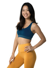 A photograph of a smiling Asian woman in a blue sports bra and yellow leggings, posing against a light background.