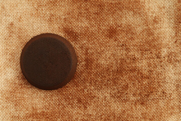 Single used coffee puck, top view, copy space, background