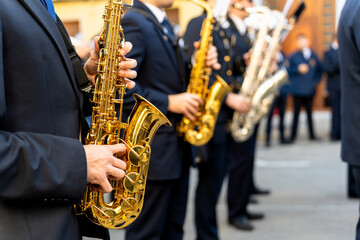 Naklejka premium Band musicians with their instruments on the street. Typical music bands in Spain.