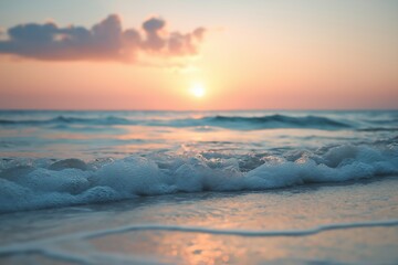Obraz premium Soft ocean waves roll in under a pastel sunset, capturing the essence of tranquility and beauty.
