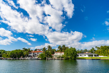 Fototapeta premium Residential architecture. Modern building. Residential apartment in waterfront city. Waterfront landscape house. Vacation building in summer. Luxury waterfront house. Hotel building. Luxury lifestyle