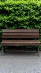 Relaxing garden area features a wooden bench and concrete table surrounded by greenery and scattered leaves for a peaceful retreat