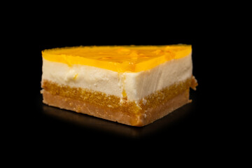 Orange cheesecake  on a black background.