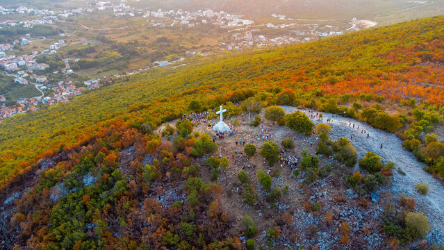 White cross on a mountain, aerial view. Mount Križevac pilgrimage site near the tourist town of Medjugorje.