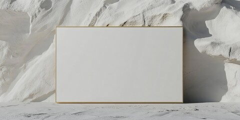 White Canvas With Gold Frame Against Textured Wall
