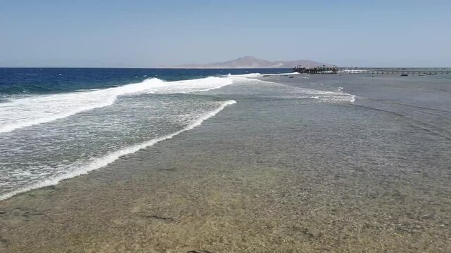 Waves crushing on the beach in Sharma El-Sheikh, Egypt