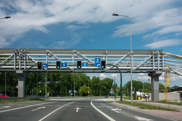 Bridge over the road in the city. Road intersection with traffic lights.