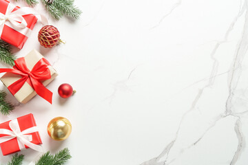 Christmas presents and decorations on white background. Flat lay image with copy space.