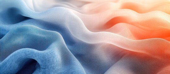 Obraz premium Soft, flowing fabric in ombre blue, white, and orange hues.
