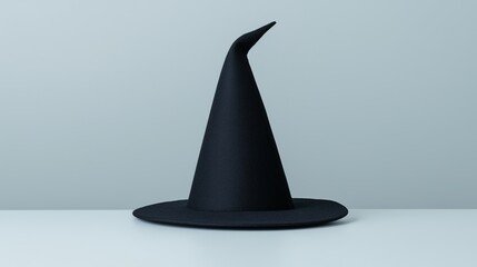 Fototapeta premium Black Witch Hat Isolated on White Background for Halloween Spooky Theme, Perfect for Decoration and Design Projects, Magic Costume Accessory, October Holiday Celebrations and Events