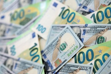 Big pile of Euro and USD banknotes. Many european and united states dollars