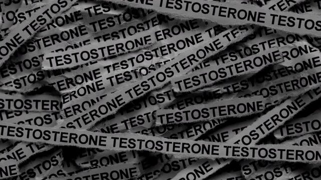 Strips of newspaper with the words Testosterone typed on them. Black and white.