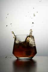 Whiskey glass splash 