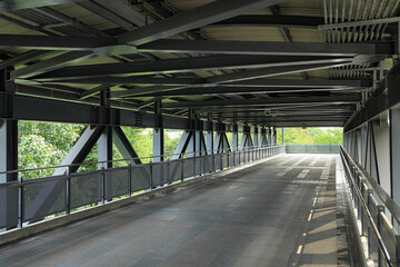 Pedestrian pathway or corridor or hallway between train station and other building.