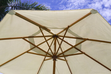 Parasol with blue sky in the background on a beautiful summer day