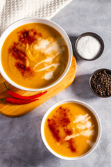 Pumpkin soup flat lay. Cream soup with paprika and chili pepper. Vegetable soup for vegan. Healthy eating. Concept of resaturant cafe healthy eating