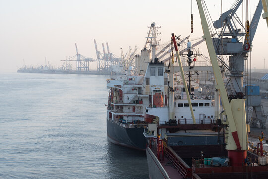 large ships, supply vessels, cargo logistics and port activities along the stretched jetty shoreline of  port kandala,  gujarat, ondoa