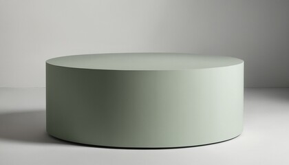 Small circular podium with matte green and light gray hues