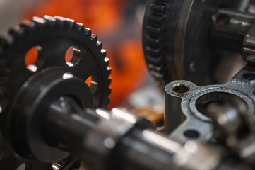 close-up of metal gears and mechanical parts symbolizing industrial equipment, precision engineering and mechanical processes, selective focus