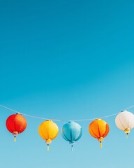 Fototapeta premium Colorful Lanterns Against a Blue Sky
