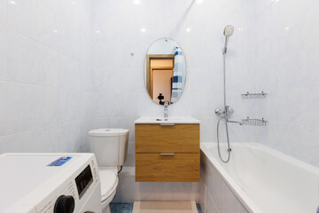 modern bathroom room with toilet and washing machine
