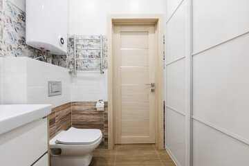 modern bathroom room with toilet and washing machine