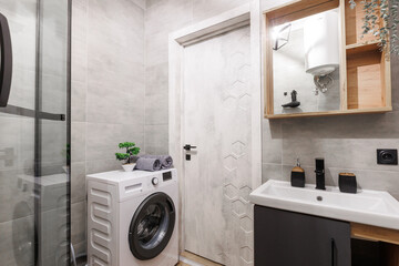 modern bathroom room with toilet and washing machine